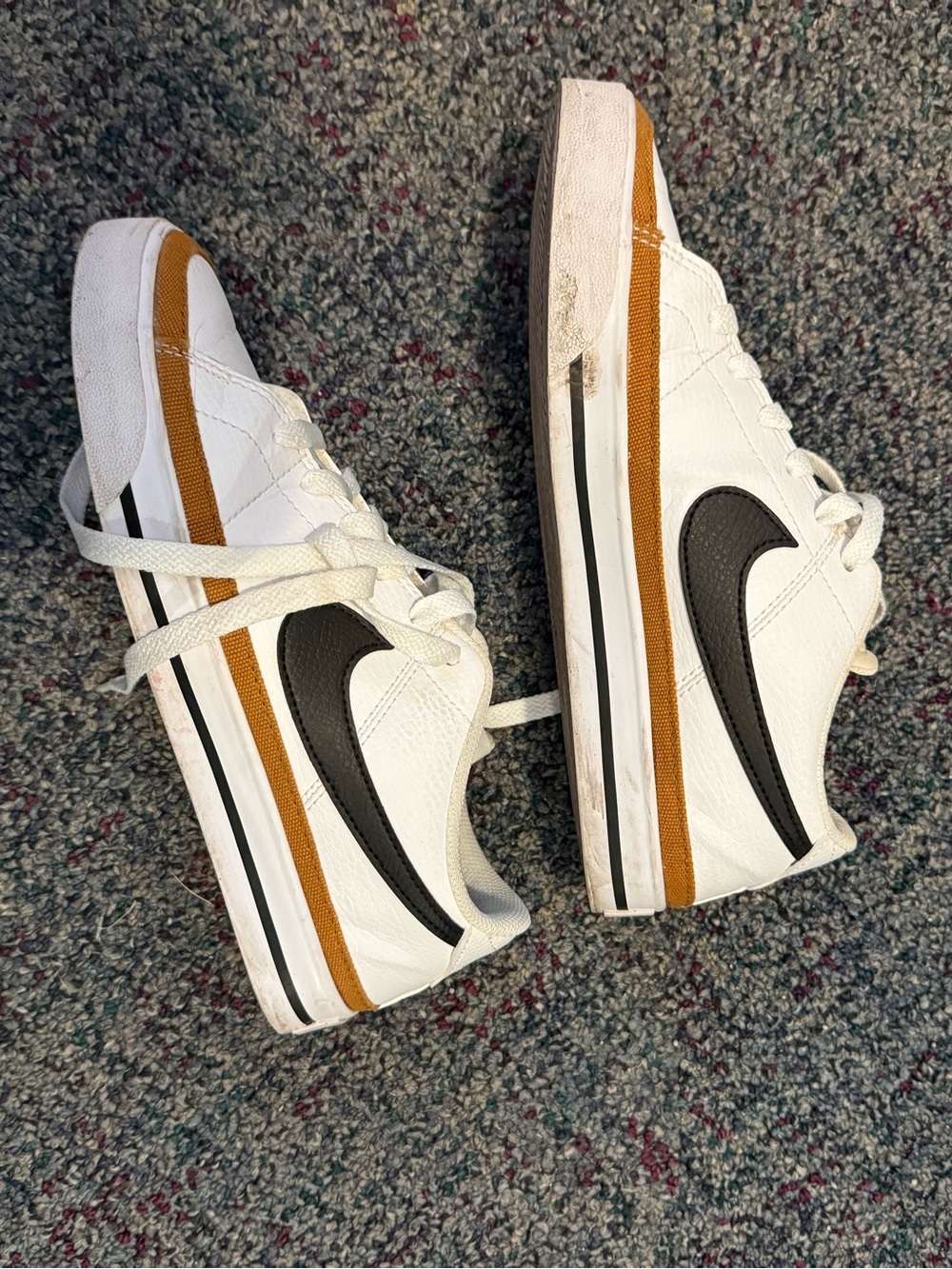 Nike women’s White Sneakers with Black Swoosh and Brown Trim
